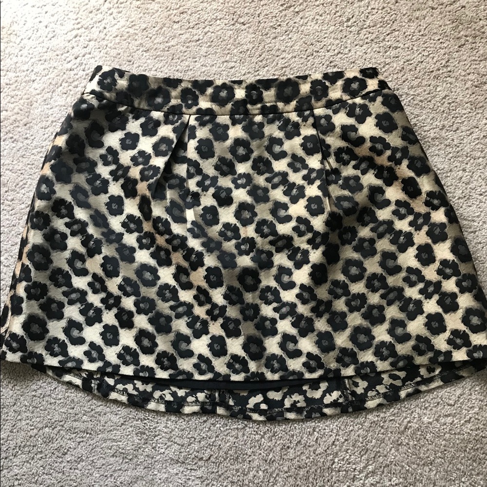 Banana Republic black & gold lined mini skirt. Adorable with black tights boots